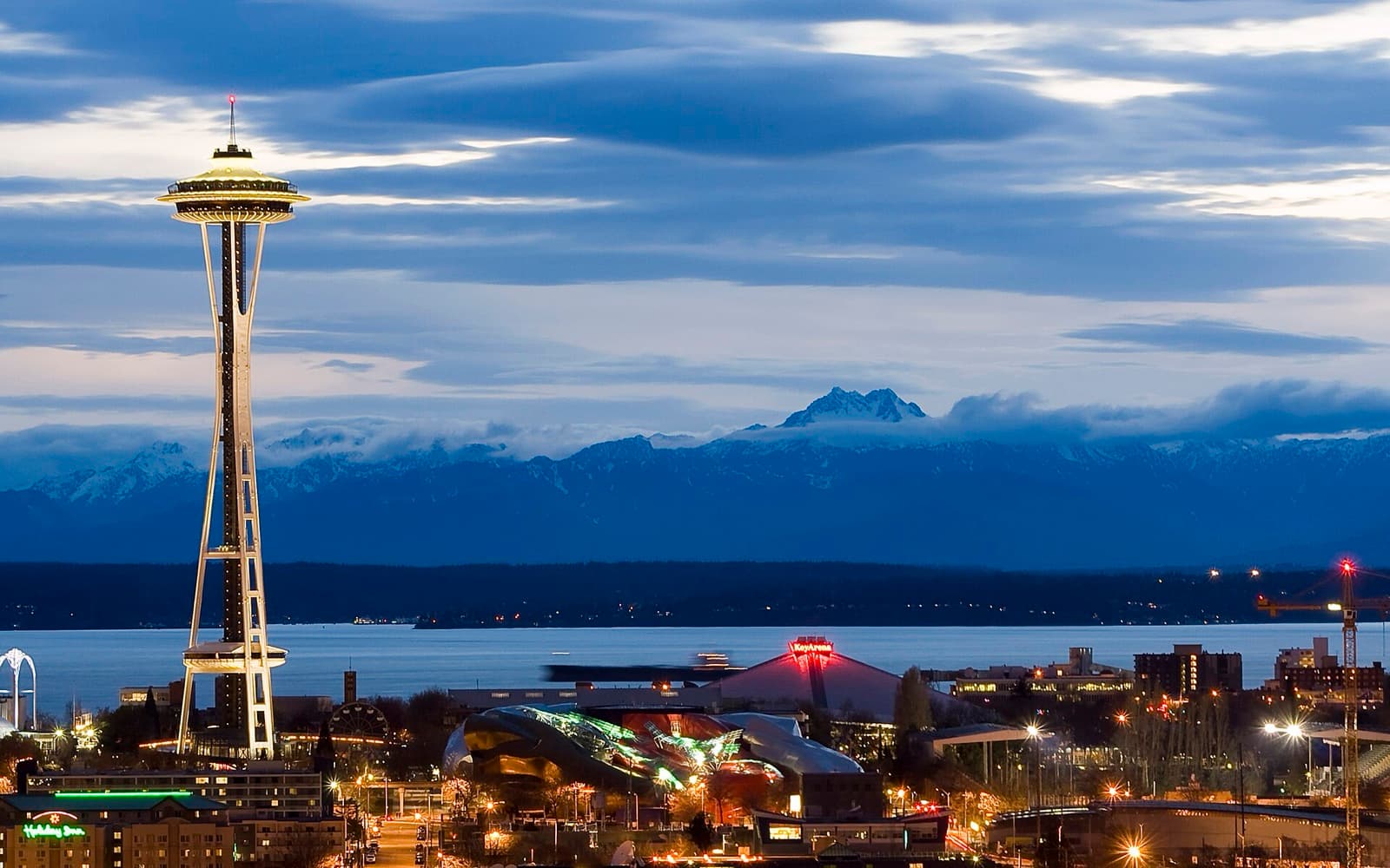 Space Needle and the Seattle skyline at dusk with Elliott Bay beyond