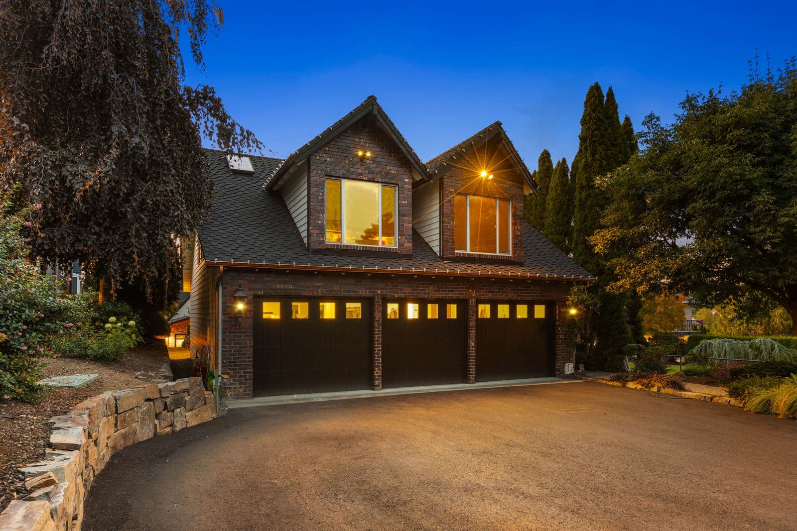 3-car garage with the ADU above, at dusk — 1504 E Lakeshore Dr, Lake Stevens